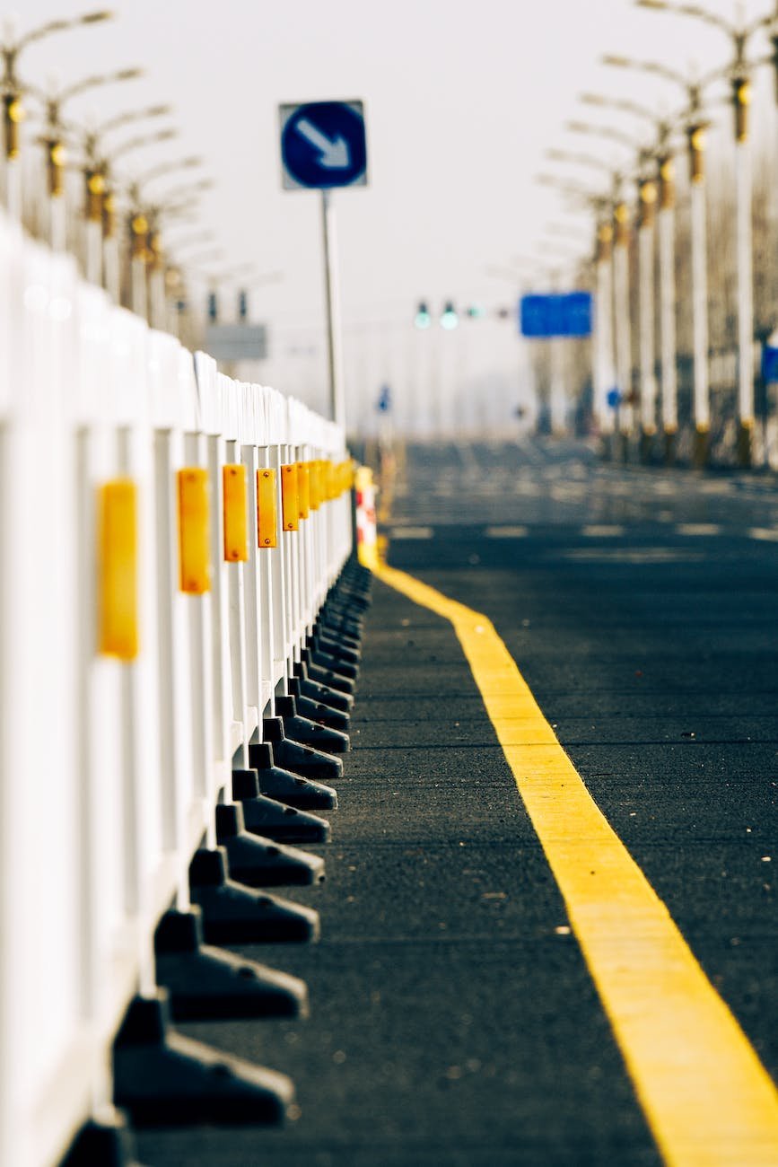 yellow line stretching along a row of construction barriers