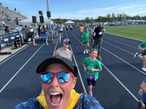 Aunties running with my daughter at her first 5K
